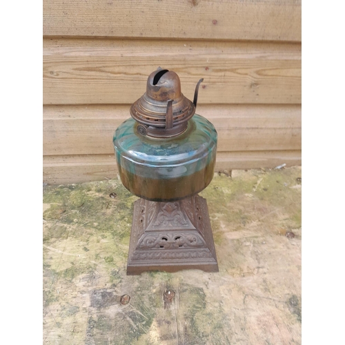 22 - Early 20th century cast metal base blue bowl paraffin lamp