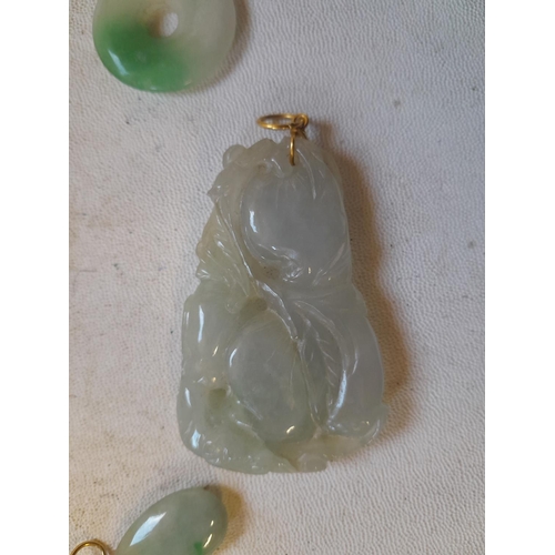 76 - 3 x pieces of Chinese carved jade, 2 set with unmarked gold  as pendants