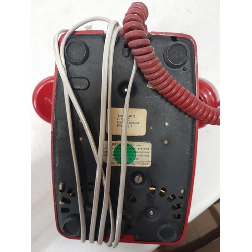 225 - Vintage red plastic telephone