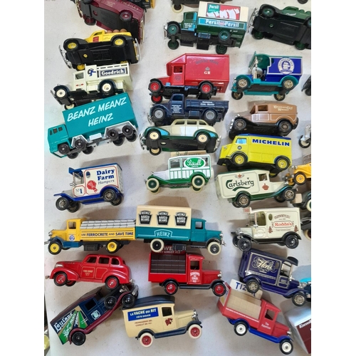 235 - Large array of unboxed die cast toy cars, advertising Lledo, and others, with some loose empty boxes