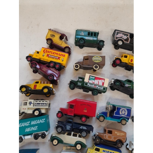 235 - Large array of unboxed die cast toy cars, advertising Lledo, and others, with some loose empty boxes