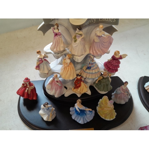 28 - Royal Doulton figurines on display stand, miniature size