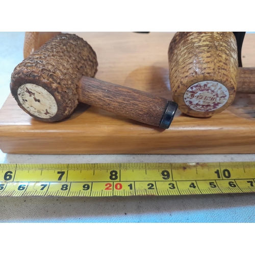 176 - Various sized vintage corn cob and other pipes in light oak rack