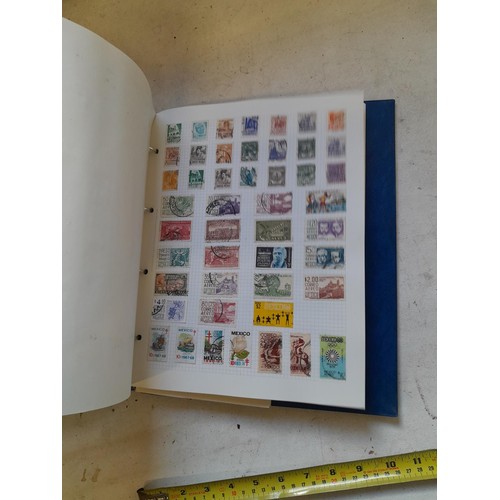 127 - Empty SG Windsor album and album of Stamps of the world mainly offered used, US interest