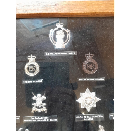 166 - Diorama of 20th century military cap badges