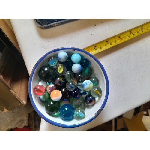 263 - Box of oddments : vintage blue and white enamel pots, marbles, pokerwork candlestick, plated ware ch... 