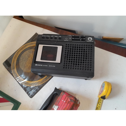 266 - Box of oddments : Magnetic compass, Sanyo cassette player, steel ball bearings etc