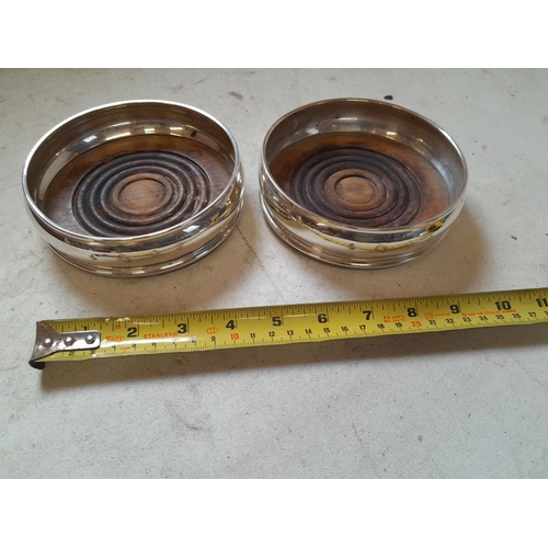 298 - Pair of silver wine coasters