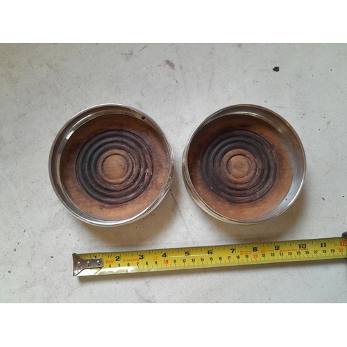 298 - Pair of silver wine coasters