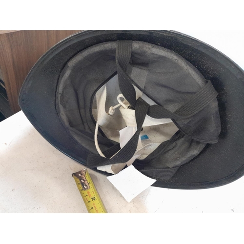 299 - Vintage Metropolitan police helmet with cap badge