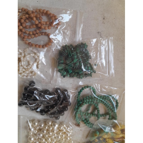 449 - Various beads ready for stringing : malachite, mother of pearl, pearls etc.