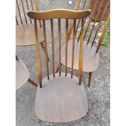 2 - Set of four Ercol Goldsmith high back dining chairs, mid colour with paper labels