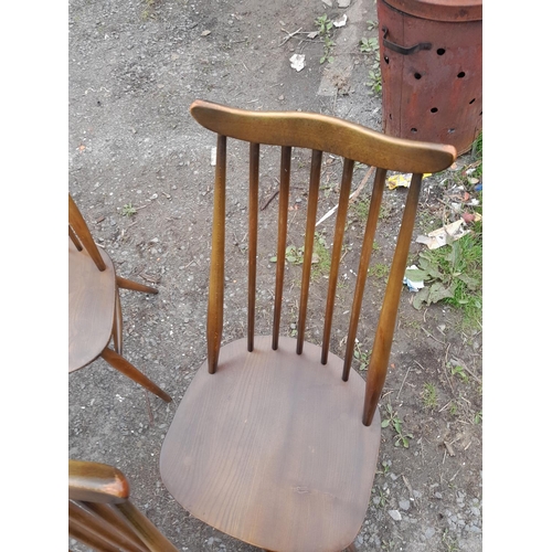 2 - Set of four Ercol Goldsmith high back dining chairs, mid colour with paper labels