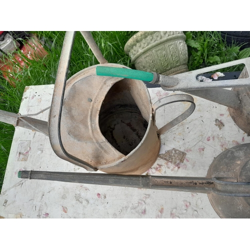 34 - 3 x galvanized watering cans and some garden tools