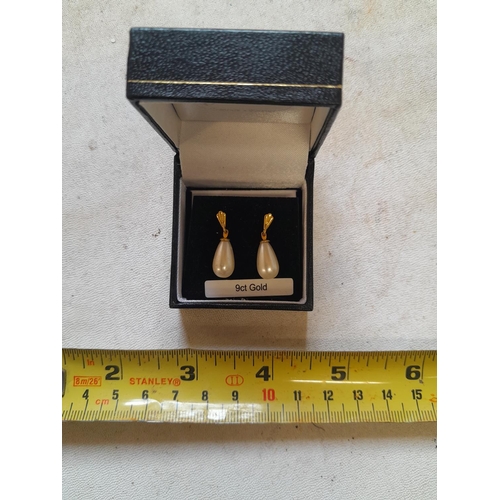 61 - Pair of 9 ct gold teardrop pearl earrings in presentation box