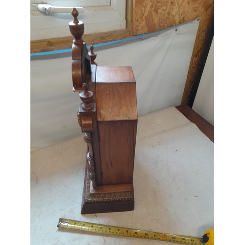 285 - Vintage  walnut case mantle clock with key and pendulum