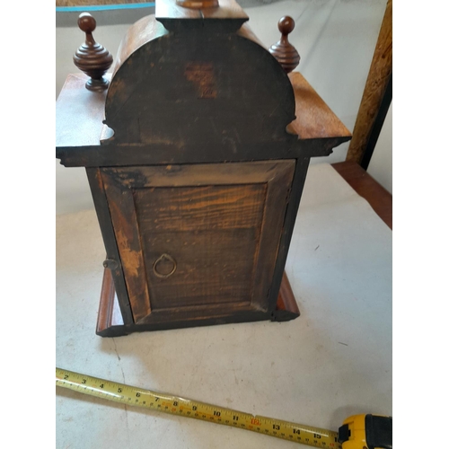 288 - Early 20th century mantle clock with arched dial with pendulum and key