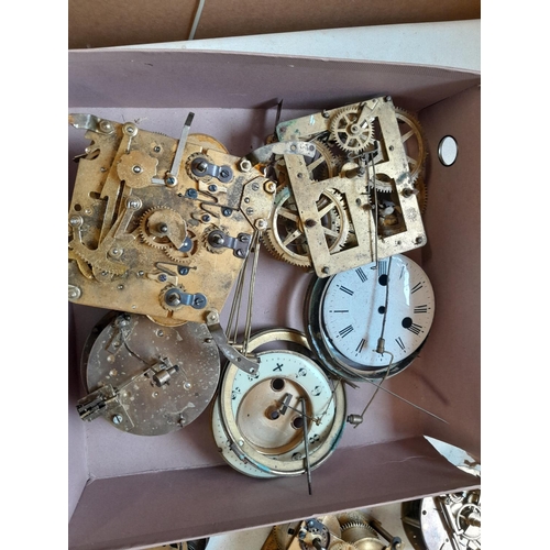 303 - Box of clock parts