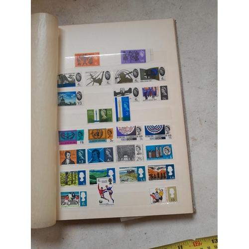 354 - Stamps of UK loosely mounted mint in album