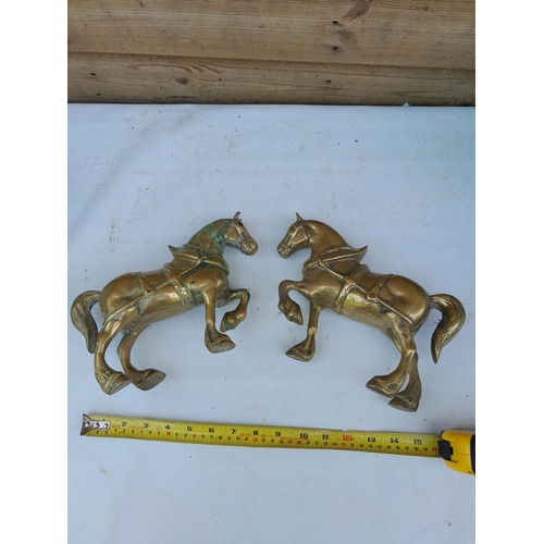 414 - Pair of solid brass horse ornaments