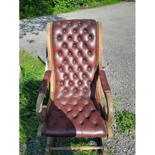 501 - 20th century leather button back, mahogany frame rocking library chair