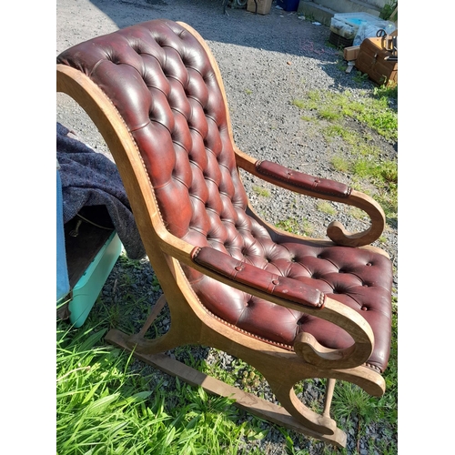 501 - 20th century leather button back, mahogany frame rocking library chair