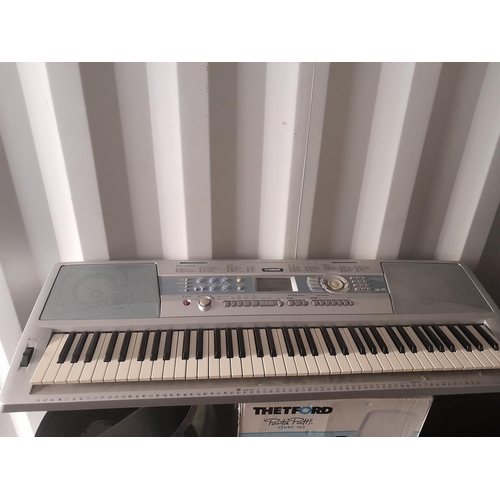 58 - Yamaha DGX 200 portable grand electric piano organ with charger and X frame stand