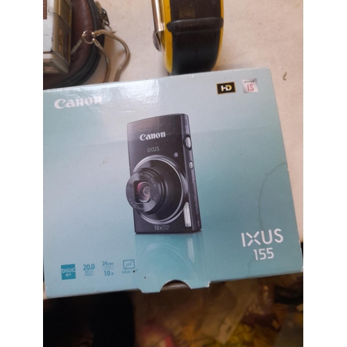 76 - Cameras : boxed Canon Ixus 155, and other cameras & 2 x mobile phones