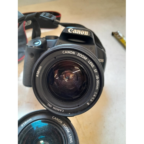 77 - Canon Eos with spare lens, padded case and some electrical cables