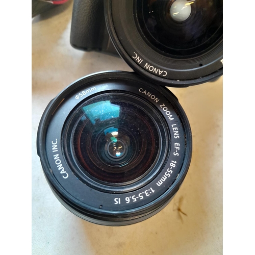 77 - Canon Eos with spare lens, padded case and some electrical cables