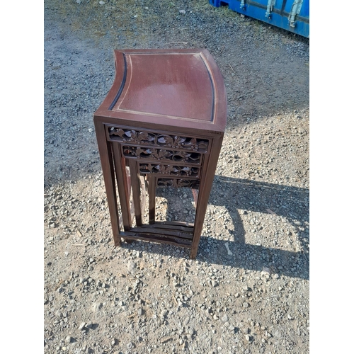 214 - Nest of four carved Chinese stained hardwood tables