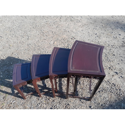 214 - Nest of four carved Chinese stained hardwood tables