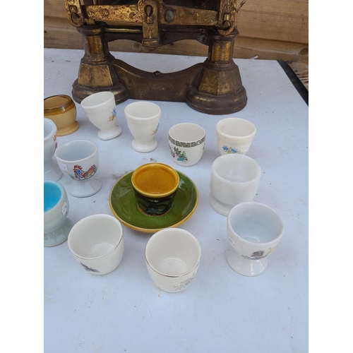 10 - Collection of vintage and later pottery and hardstone egg cups, kitchen scales