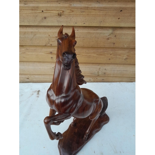 29 - 20th century finely executed South East Asian carved Rosewood figure of a prancing horse