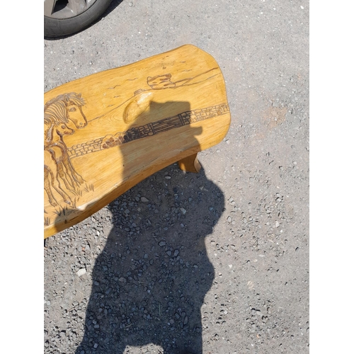 123 - Rustic carved ash coffee table, horse and pony theme possibly by Guy Solf