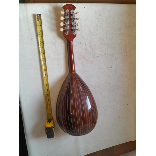 126 - Vintage Suzuki Violin Company bowl back 8 string mandolin, heavily inlaid in good order with soft ca... 