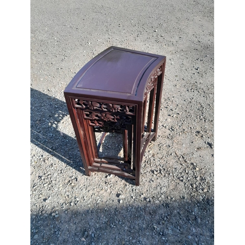 159 - Nest of four carved Chinese stained hardwood tables