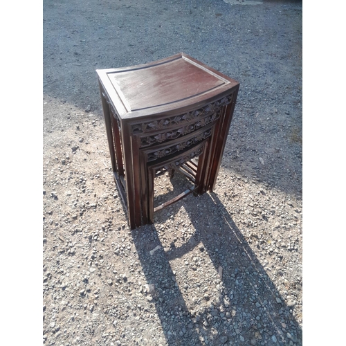 159 - Nest of four carved Chinese stained hardwood tables