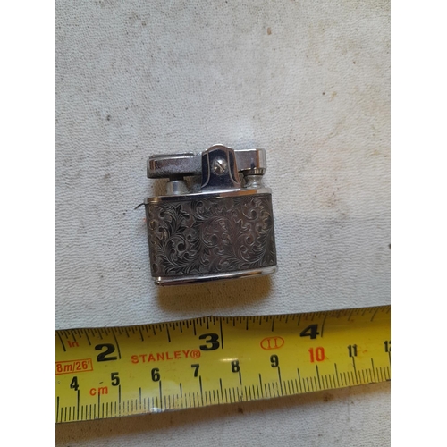 117 - Very rare Rodan pocket lighter, with floral decorated white metal jacket, from the 1950s