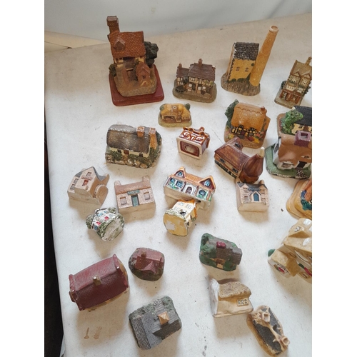 13 - Various resin, plaster and pottery cottage ornaments, (David Winter interest) in various states of r... 