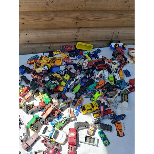 74 - Box of assorted play worn die cast toy cars, various makers and dates