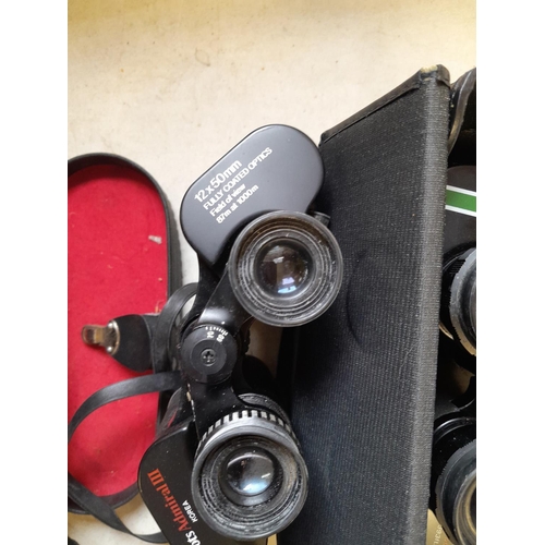 99 - 2 x pairs of binoculars : Boots Admiral III 12 x 50,  Swift Belmont 10 x 50 &