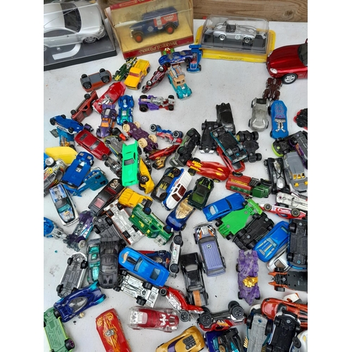 103 - Assorted play worn die cast toy cars, differing makers and dates