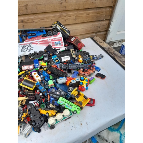 106 - Assorted play worn die cast toy cars, differing makers and dates