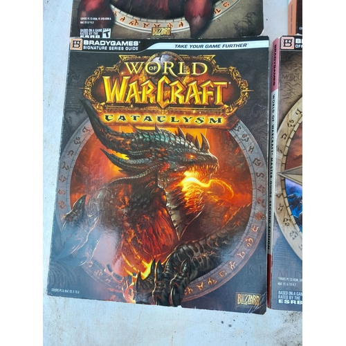 146 - 4 x World Of Warcraft softback books