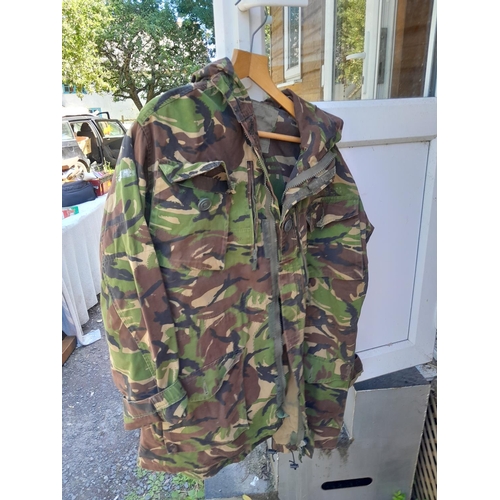 180 - Fishing rods and camouflage jacket