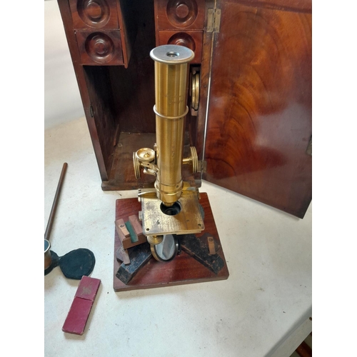 243 - 19th century microscope by Abraham & Co of Liverpool, with spares lenses, slides and other accessori... 