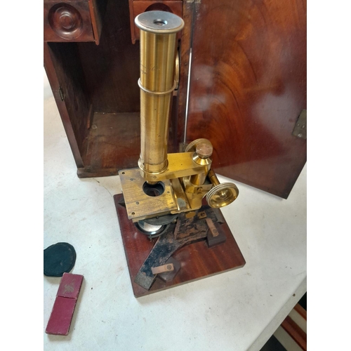 243 - 19th century microscope by Abraham & Co of Liverpool, with spares lenses, slides and other accessori... 