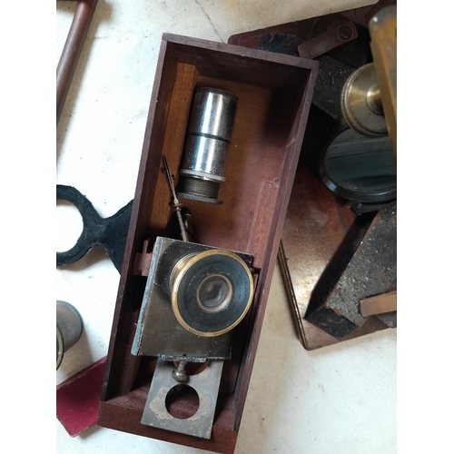 243 - 19th century microscope by Abraham & Co of Liverpool, with spares lenses, slides and other accessori... 