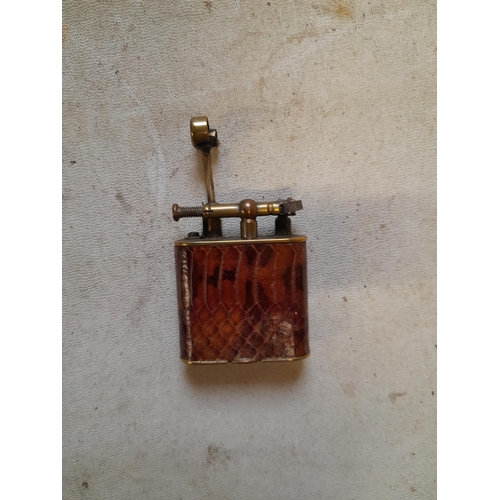 149 - Dunhill Unique lighter with lift arm action with lizard skin decoration Pat 143762 from the mid 1920... 